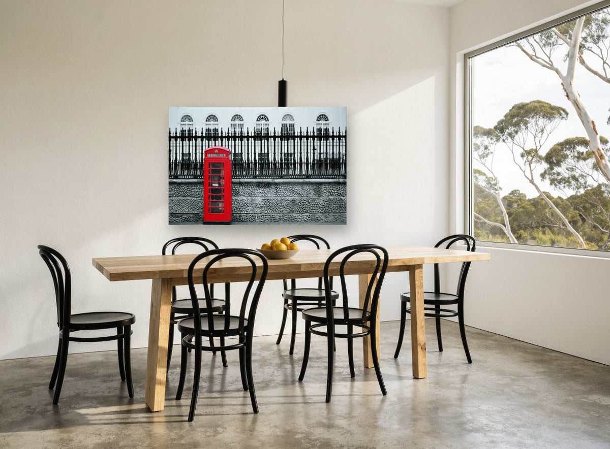 Red Box Against Railings city canvas print on the wall of a dining room