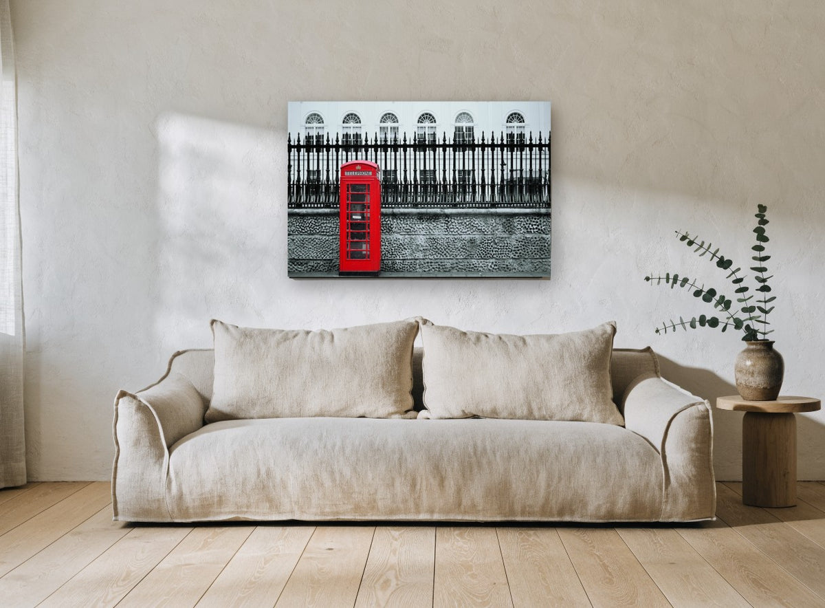 Red Box Against Railings city canvas print on the wall of a living room