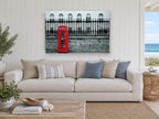 Red Box Against Railings city canvas print on the wall of a beach house living room