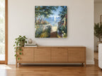 Garden Path to the Bay coastal canvas print on the wall of a living room above a sideboard