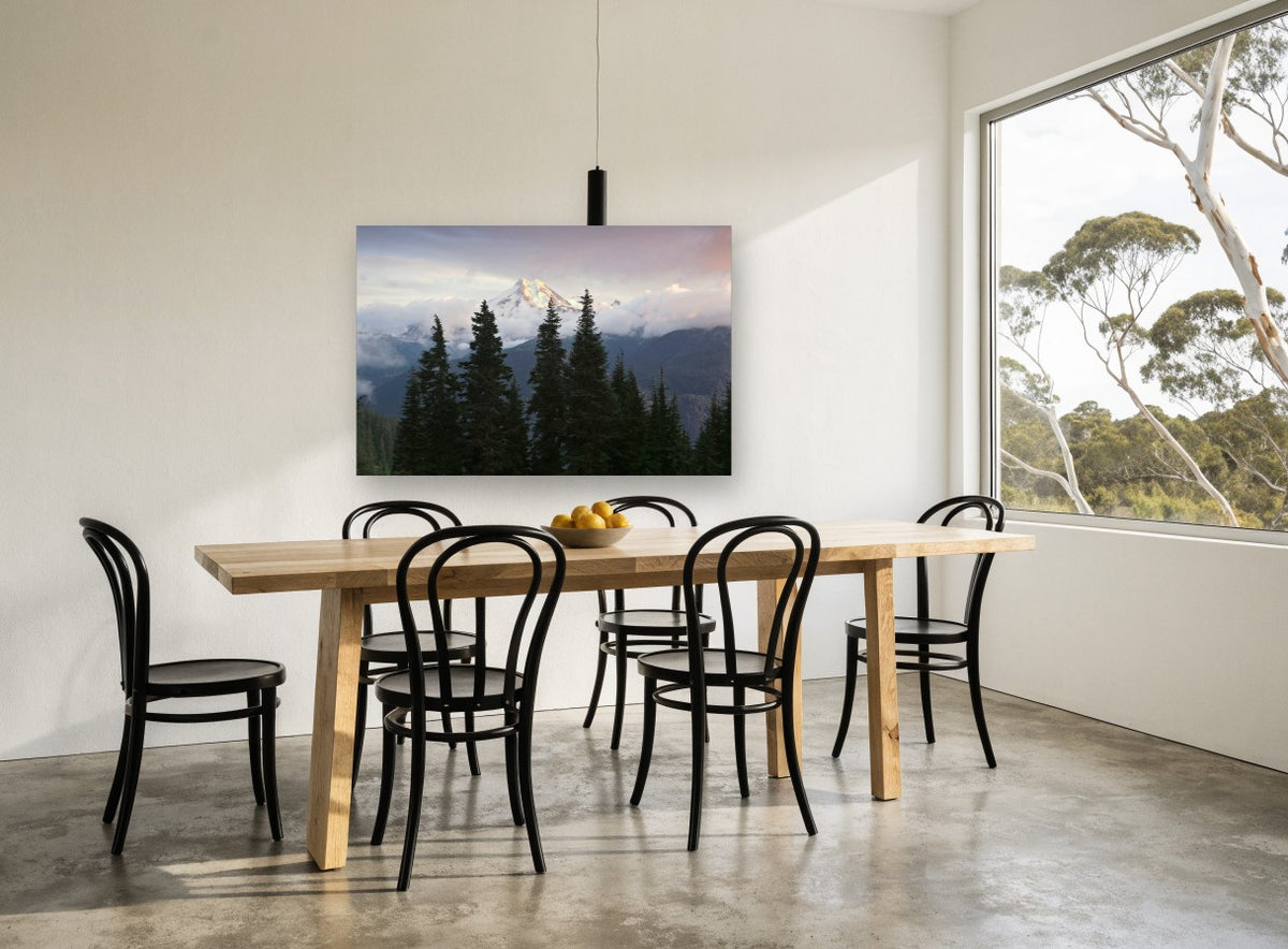 Alpine Glow Firs landscape canvas print on the wall of a dining room
