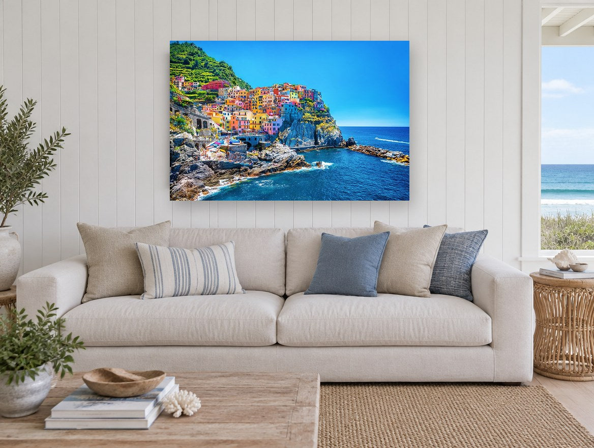 Cinque Terre Cliffside Village coastal canvas print on the wall of a beach house living room