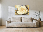 Cream Rose Bloom floral canvas print on the wall of a living room