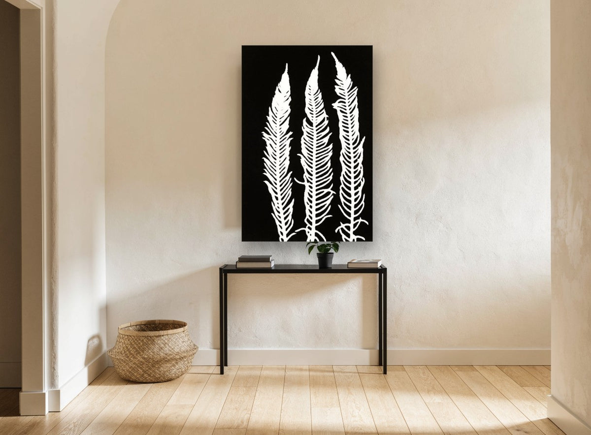 Three White Fern Fronds floral canvas print on the wall of a hallway