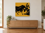 Ochre Bull and Matador animal canvas print on the wall of a living room above a sideboard