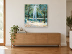 Fountain in the Park landscape canvas print on the wall of a living room above a sideboard