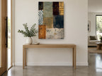 Earthen Patchwork Panels floral canvas print on the wall of a entry hall