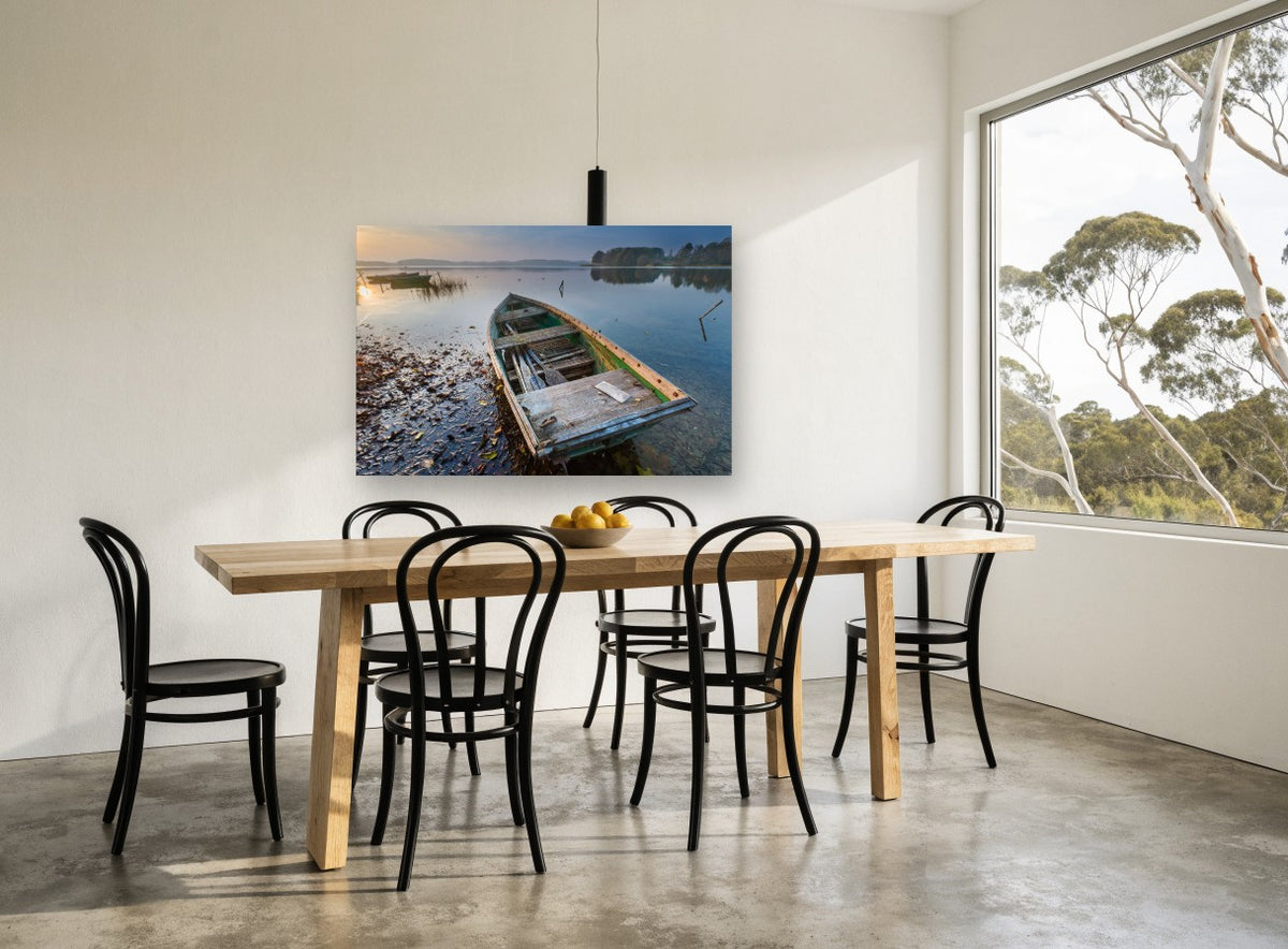 Weathered Rowboat Dawn landscape canvas print on the wall of a dining room