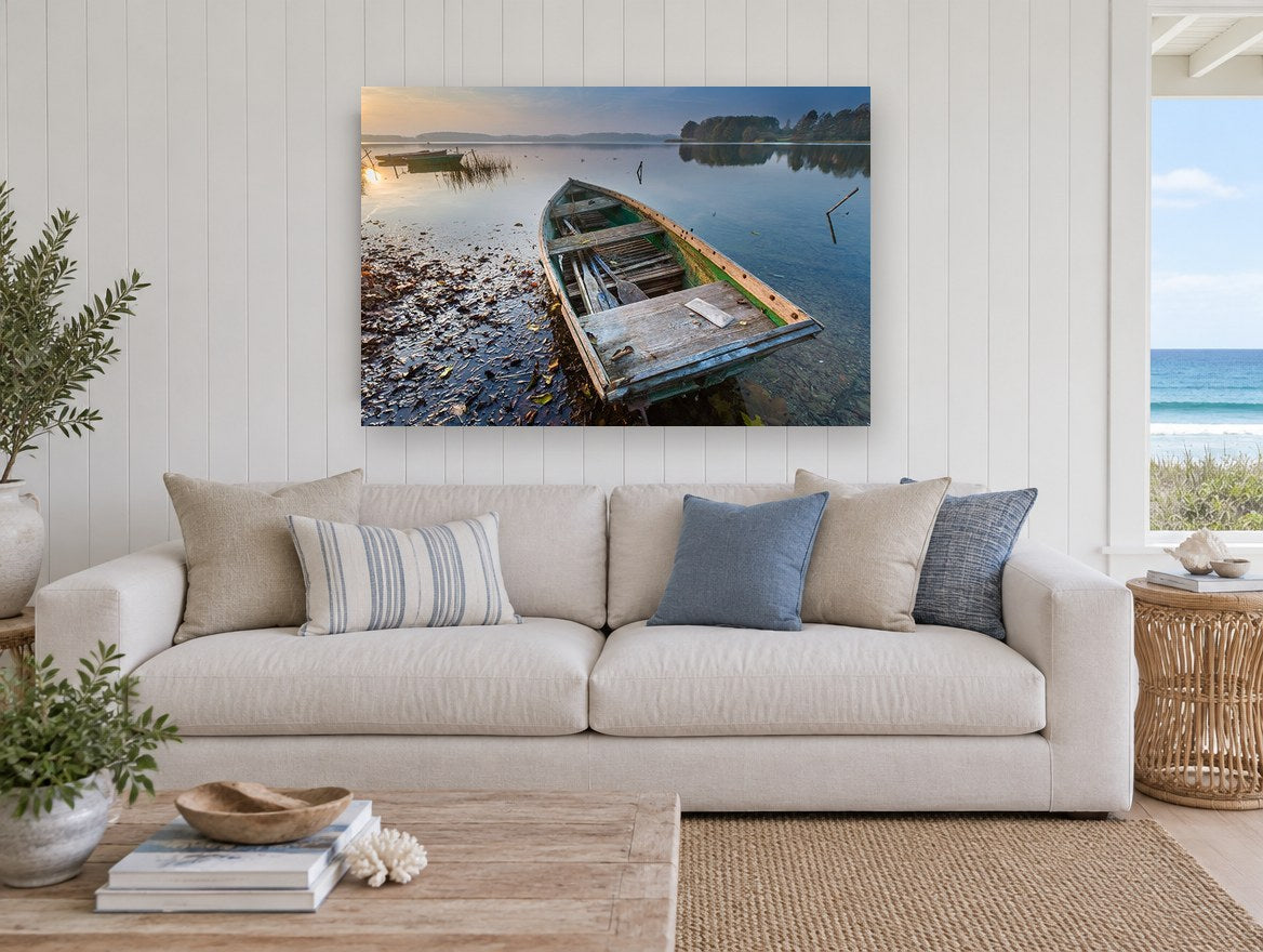 Weathered Rowboat Dawn landscape canvas print on the wall of a beach house living room