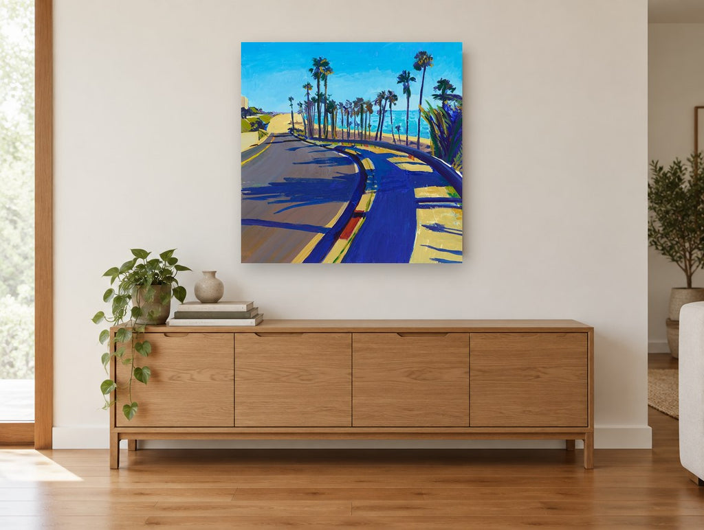 Palm Shadow Coast Road coastal canvas print on the wall of a living room above a sideboard