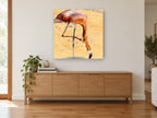 Feeding Flamingo Study animal canvas print on the wall of a living room above a sideboard