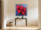 Crimson Haze Blooms floral canvas print on the wall of a hallway