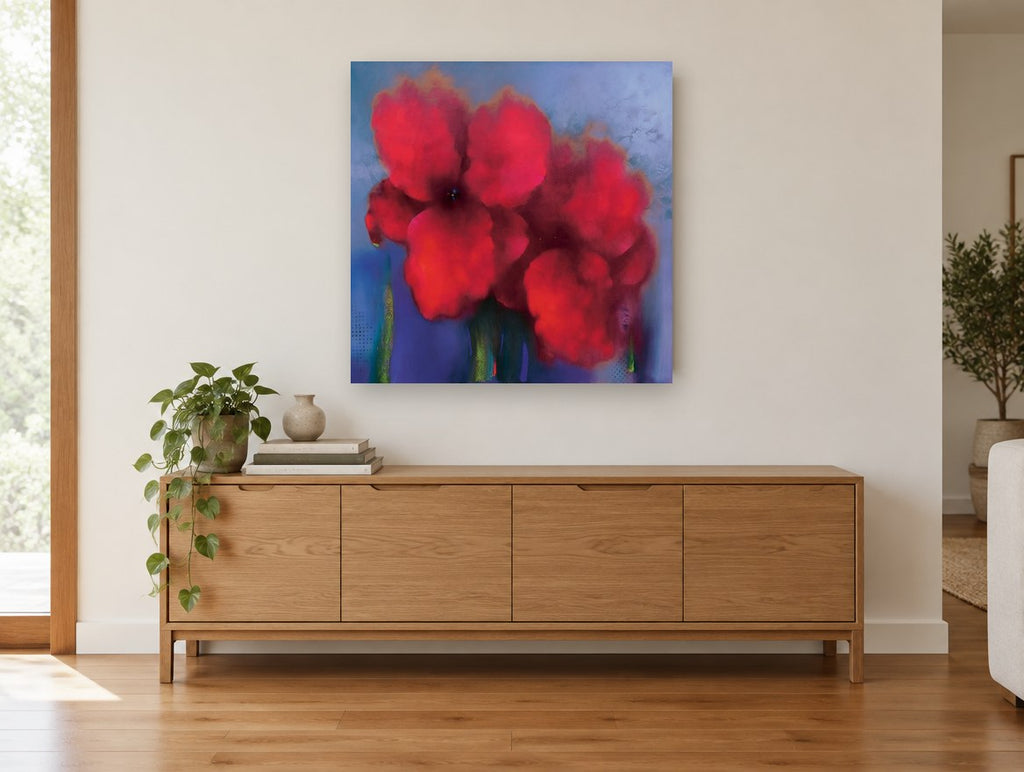 Crimson Haze Blooms floral canvas print on the wall of a living room above a sideboard