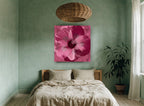 Magenta Hibiscus Bloom floral canvas print on the wall of a bedroom