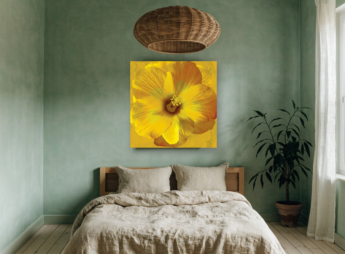 Golden Hibiscus Bloom floral canvas print on the wall of a bedroom