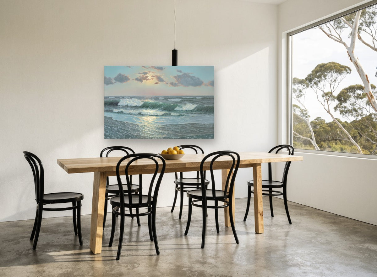 Pebble Shore Sunrise coastal canvas print on the wall of a dining room