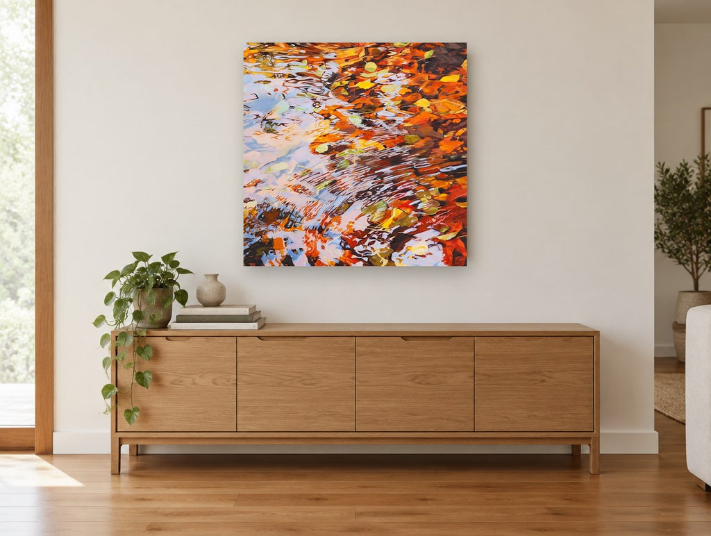 Autumn Pond Ripples landscape canvas print on the wall of a living room above a sideboard