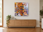 Autumn Leaf Ripples landscape canvas print on the wall of a living room above a sideboard