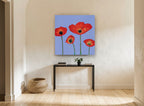 Red Poppies on Periwinkle floral canvas print on the wall of a hallway