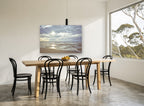 Low Tide Sunburst coastal canvas print on the wall of a dining room