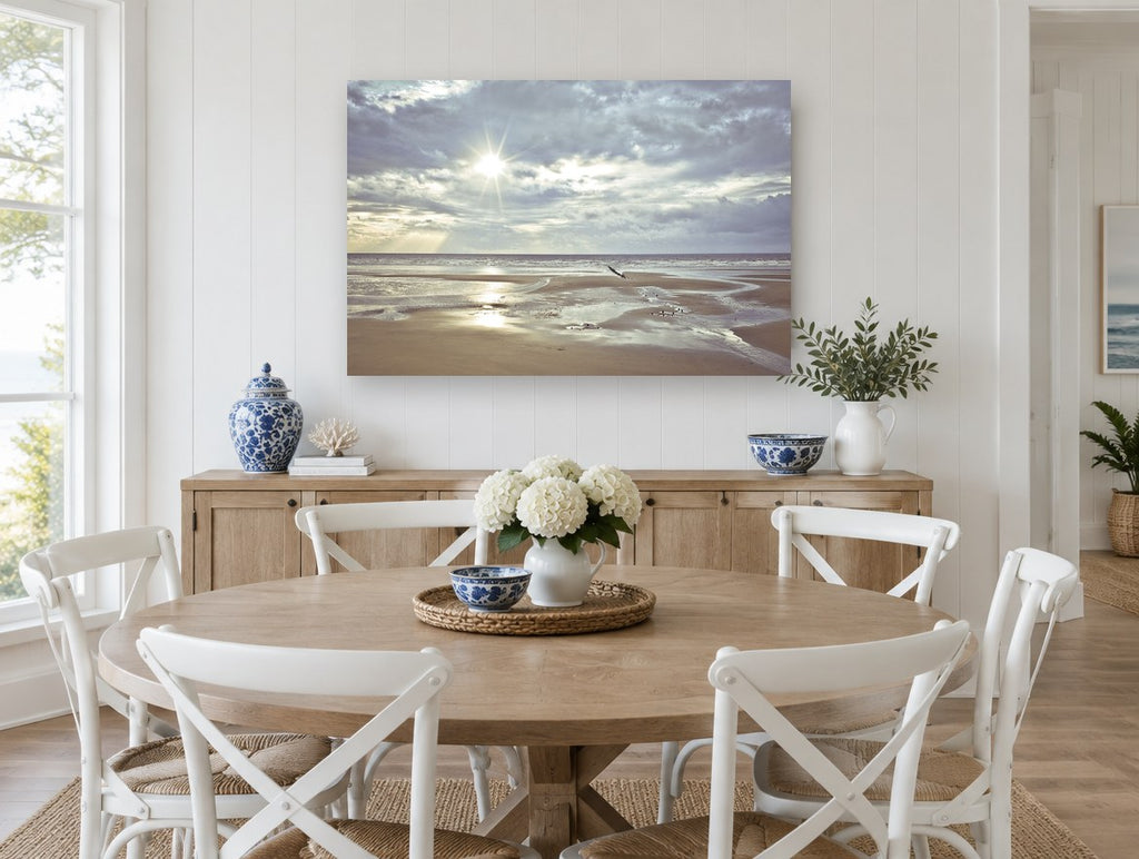 Low Tide Sunburst coastal canvas print on the wall of a Hamptons dining room