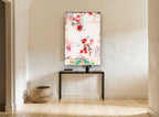 Crimson Blossom Drift floral canvas print on the wall of a hallway