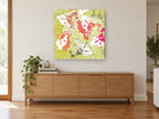 Chartreuse Hibiscus Collage floral canvas print on the wall of a living room above a sideboard