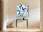 Plum Hibiscus on Aqua floral canvas print on the wall of a hallway