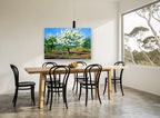 Orchard in White Blossom floral canvas print on the wall of a dining room