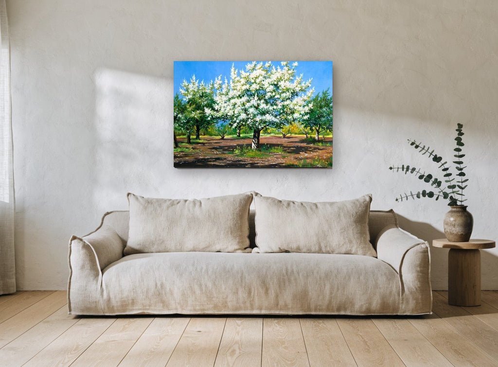 Orchard in White Blossom floral canvas print on the wall of a living room