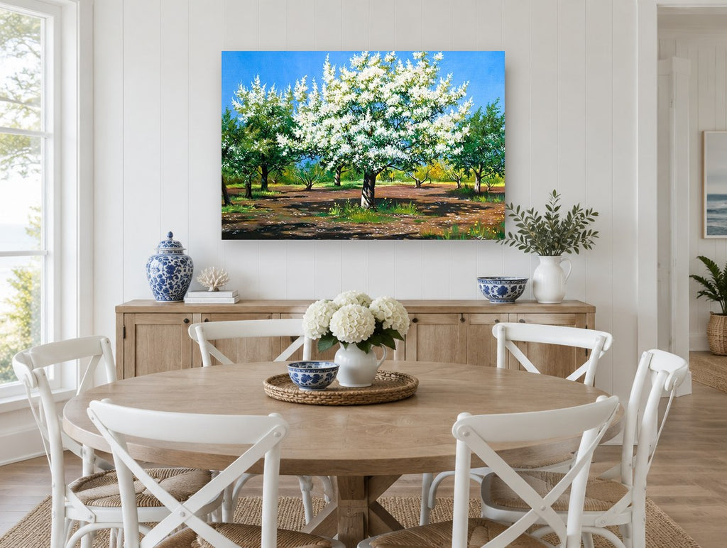 Orchard in White Blossom floral canvas print on the wall of a Hamptons dining room