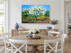 Orchard in White Blossom floral canvas print on the wall of a Hamptons dining room