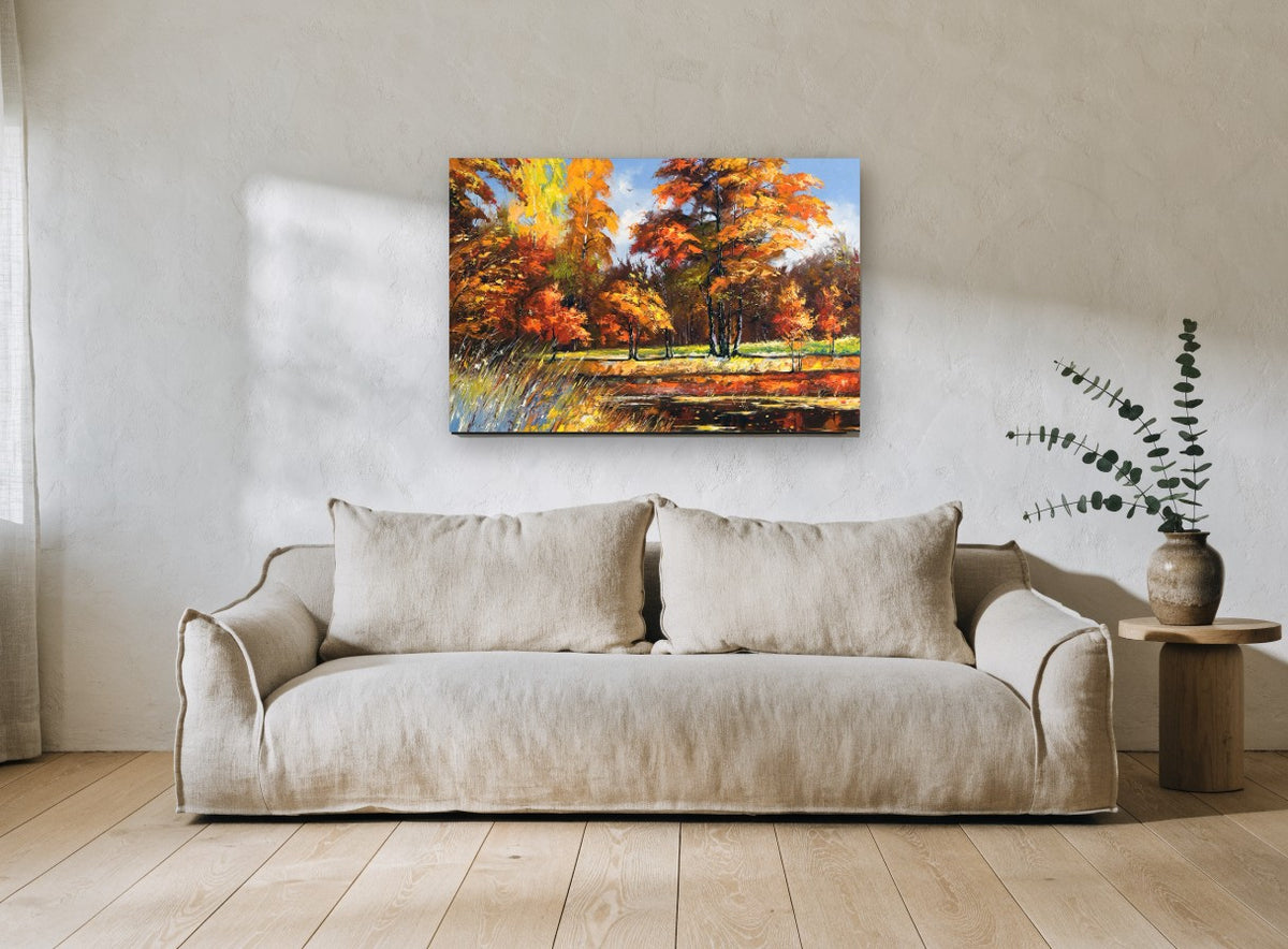 Autumn Pond Glow landscape canvas print on the wall of a living room