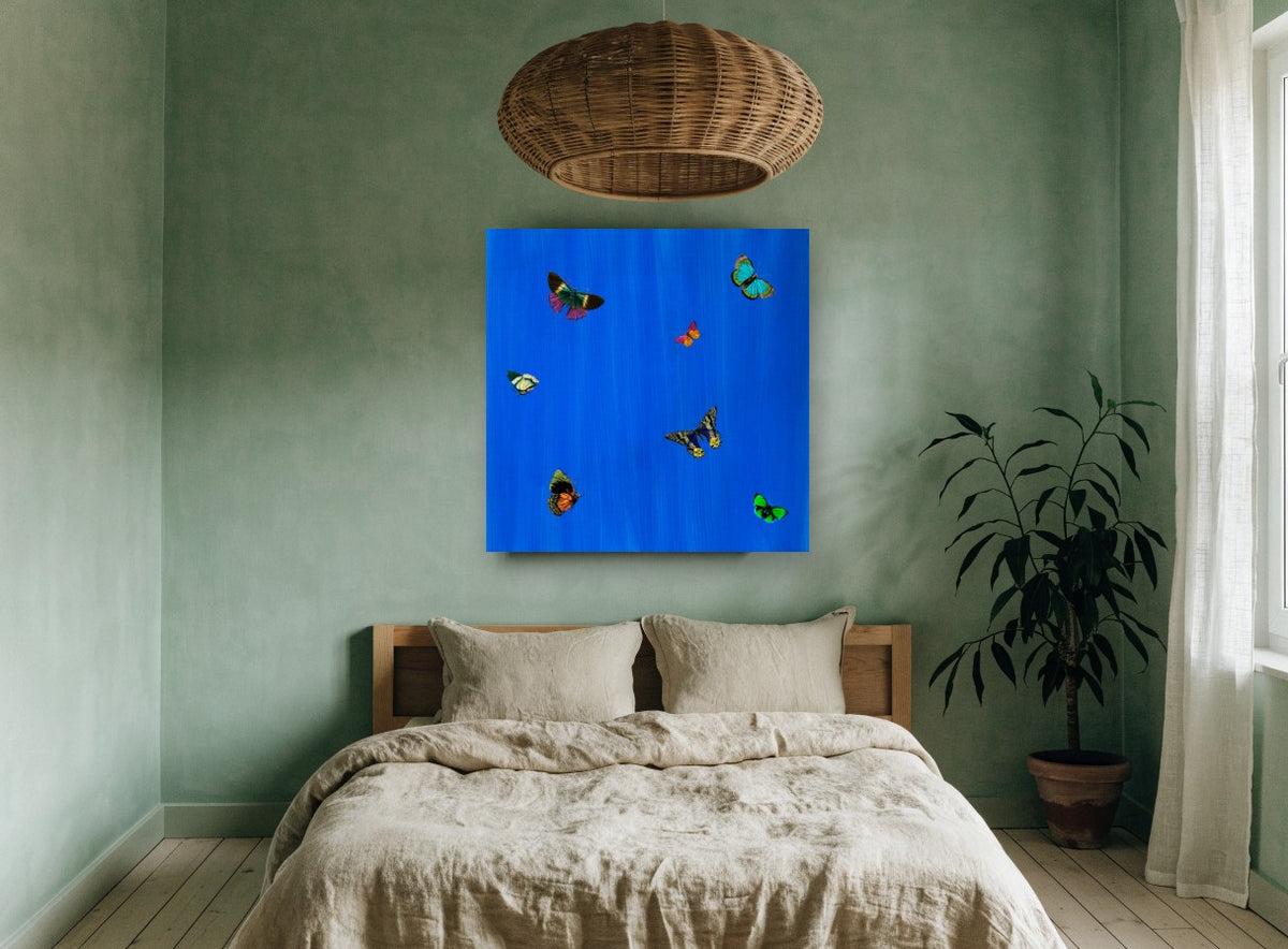 Butterflies on Cobalt animal canvas print on the wall of a bedroom