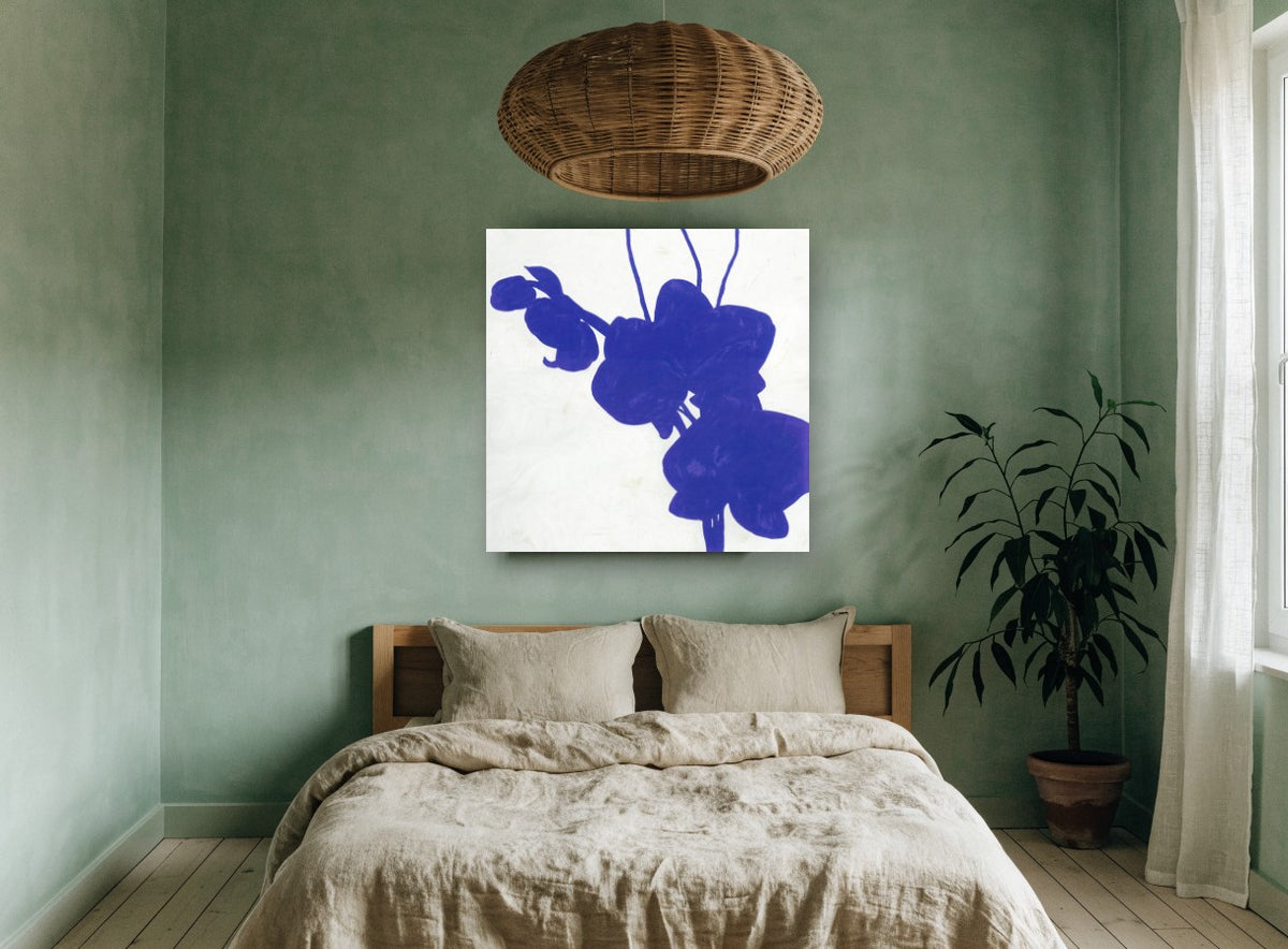 Indigo Orchid Silhouette floral canvas print on the wall of a bedroom