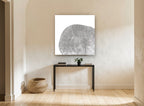 Grey Tree Ring Slice floral canvas print on the wall of a hallway