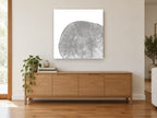 Grey Tree Ring Slice floral canvas print on the wall of a living room above a sideboard
