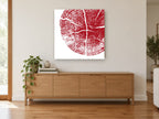 Crimson Tree Rings floral canvas print on the wall of a living room above a sideboard