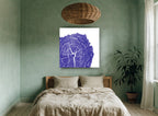 Indigo Tree Rings floral canvas print on the wall of a bedroom