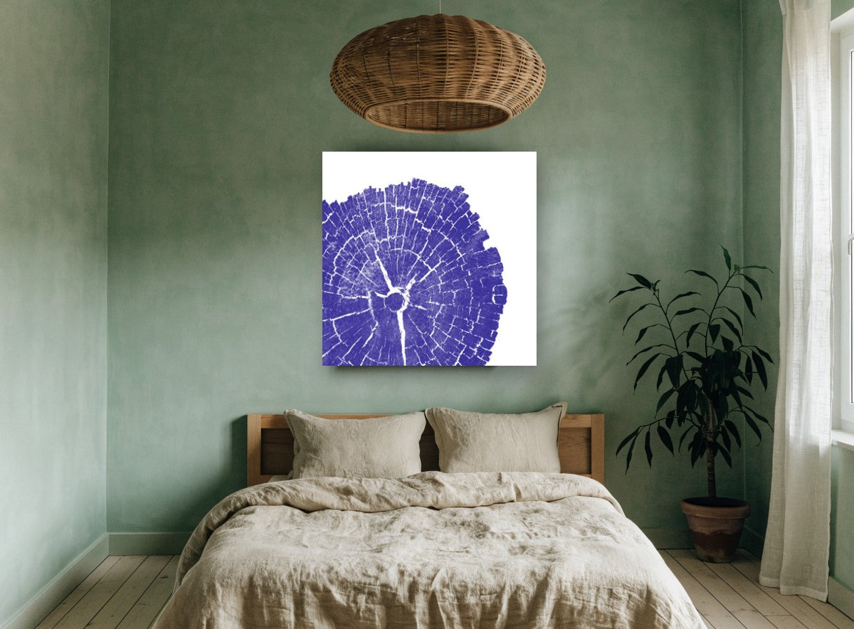 Indigo Tree Rings floral canvas print on the wall of a bedroom