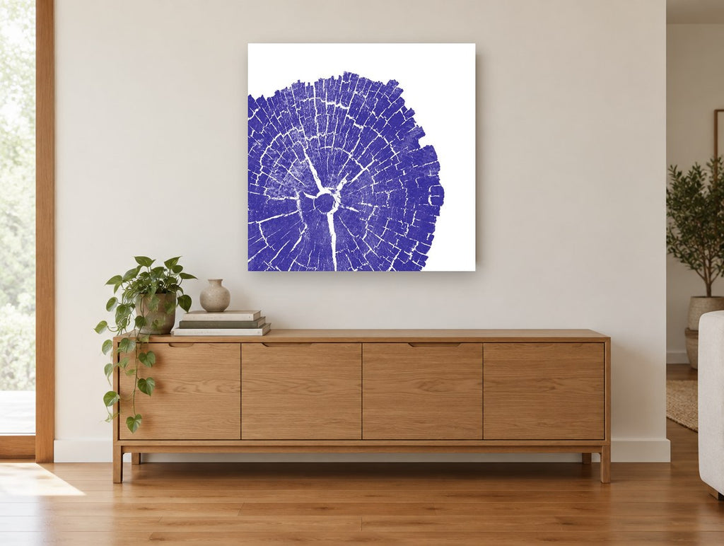 Indigo Tree Rings floral canvas print on the wall of a living room above a sideboard