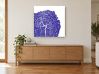 Indigo Tree Rings floral canvas print on the wall of a living room above a sideboard