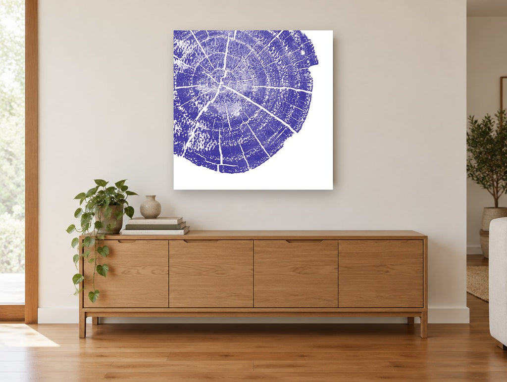 Indigo Tree Rings floral canvas print on the wall of a living room above a sideboard