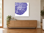 Indigo Tree Rings floral canvas print on the wall of a living room above a sideboard