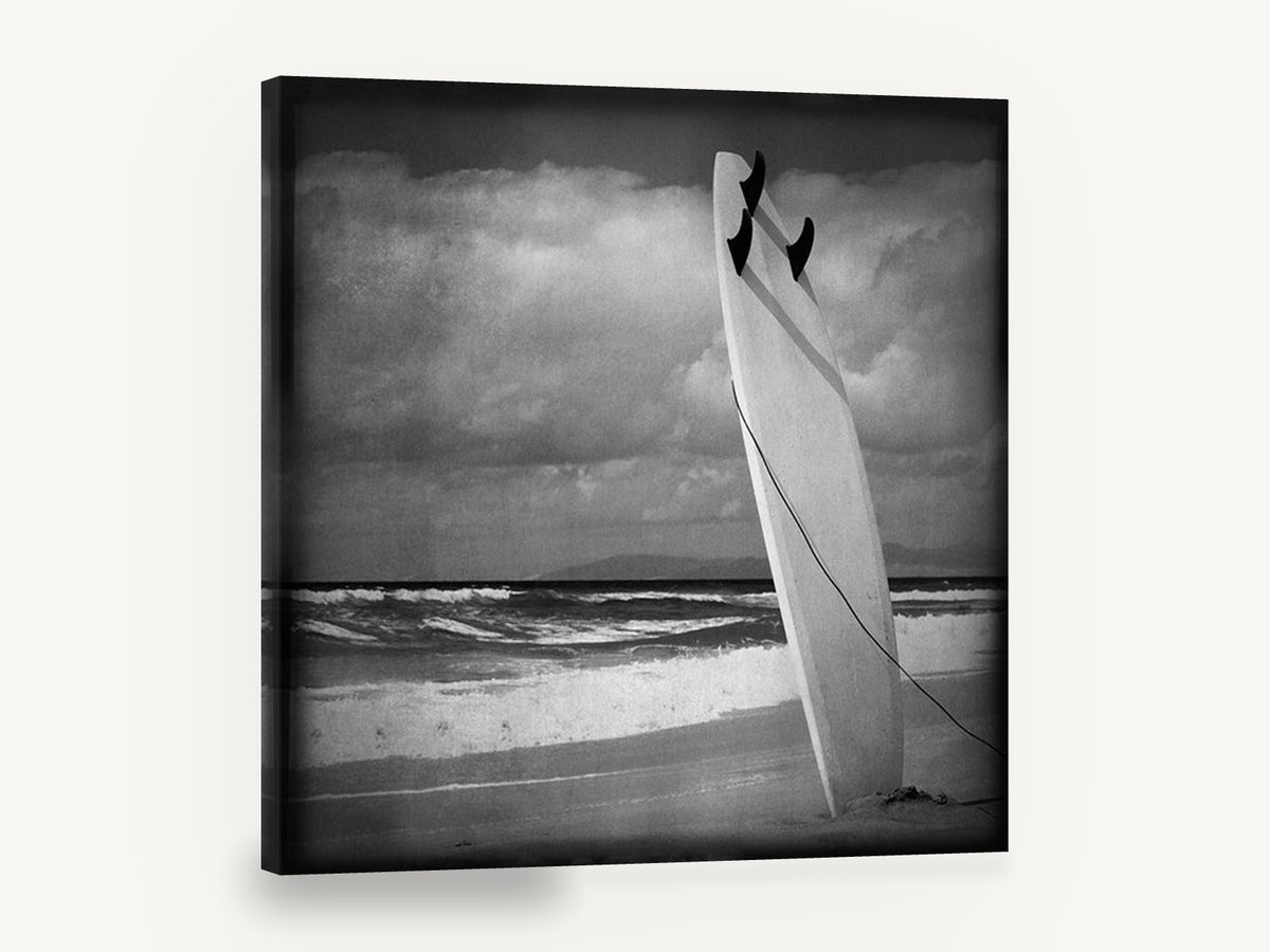 Standing Surfboard Dusk, surfboard on beach black and white, coastal canvas wall art print ready to hang