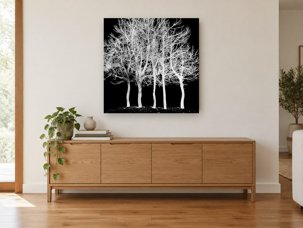 Ghost Grove landscape canvas print on the wall of a living room above a sideboard