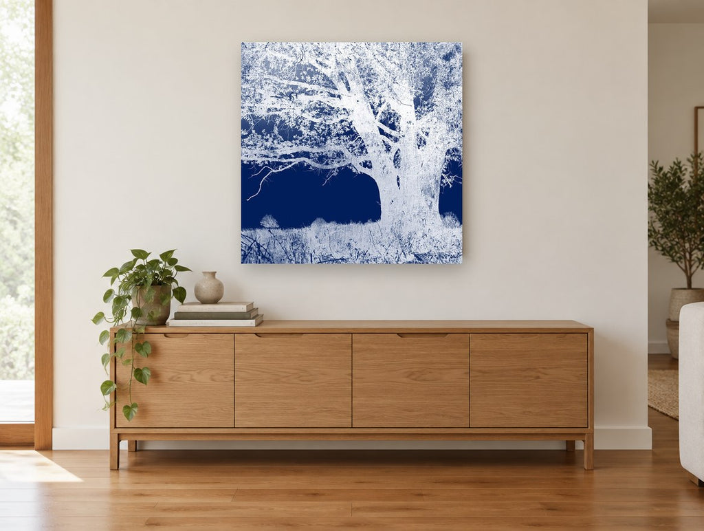 Inverted Indigo Oak landscape canvas print on the wall of a living room above a sideboard