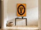 Tangerine Elephant Cameo vintage canvas print on the wall of a hallway