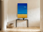 Lone Sail Calm coastal canvas print on the wall of a hallway