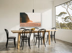 Golden Cliff Shore coastal canvas print on the wall of a dining room